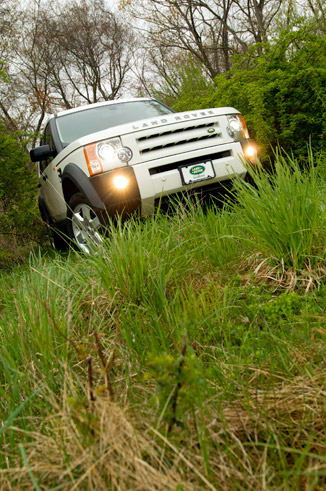 land rover climbing a hill